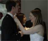 Christina adjusts brother Andrew's cravat